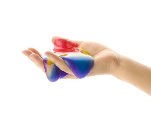 Preview: Woman playing with colorful slime isolated on white, closeup. Antistress toy
