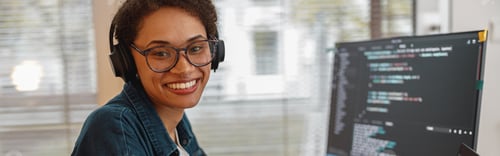 Preview: Afro american woman in headphones freelance data scientist work remotely at home office