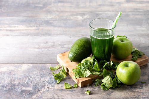 Preview: Green smoothie detox with Kale, avocado and apples on wooden table
