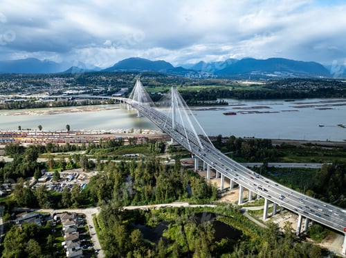 Preview: View of a Portman Bridge, crossing a river in an urban landscape.