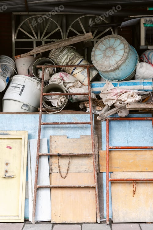 Preview: Vertical shot of a wooden cart with old construction materials