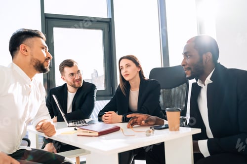 Preview: Office meeting of a group of young company workers