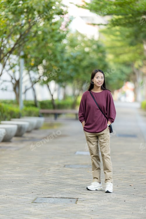 Preview: Woman look at the camera in city