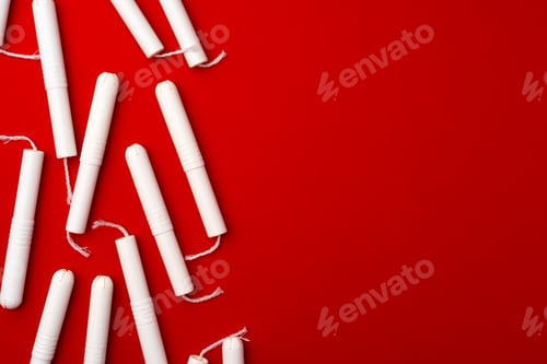 Preview: Pile of female tampons on red background