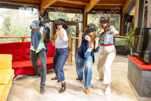 Preview: Group of young people playing with virtual reality and visor