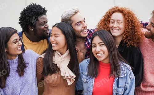 Preview: Group of happy multiracial friends enjoy day together in the city
