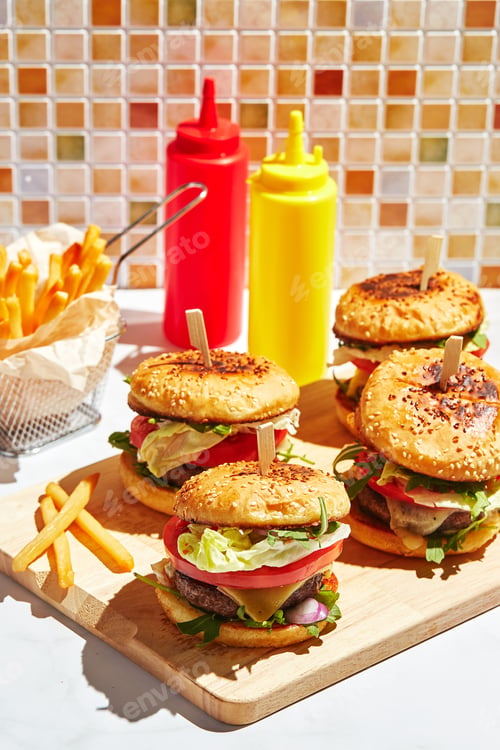 Preview: Delicious Burgers and Fries on a Wood Board