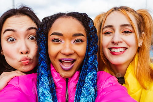 Preview: Multiracial group of young friends meeting outdoors in winter