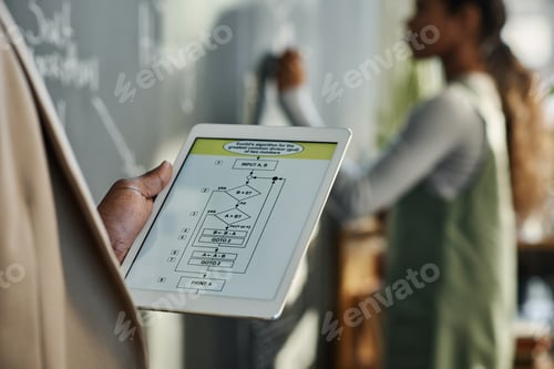 Preview: Teacher using digital tablet at lesson