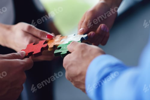 Preview: Group Of Business People Assembling Jigsaw Puzzle And Represent Team Support And Help Concept