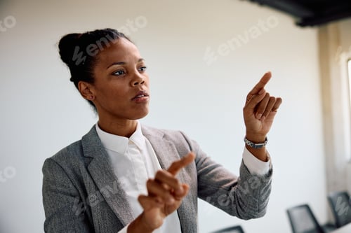 Preview: Black female entrepreneur at corporate office.