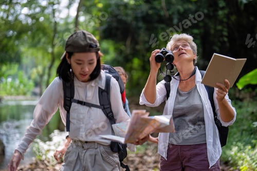 Preview: Backpack tourist travel outdoor adventure bird study using binoculars looking and record to book
