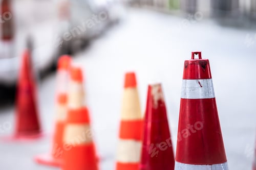 Preview: An orange traffic cone is placed on the road.