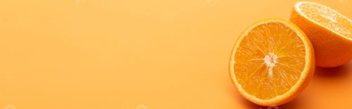 Preview: ripe delicious orange halves on colorful background, panoramic crop