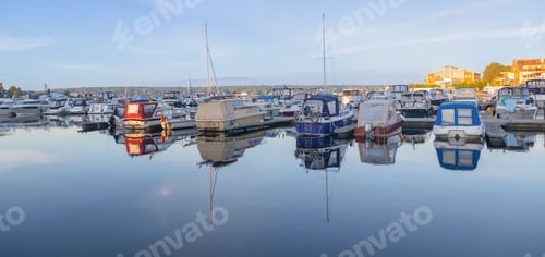 Preview: boats and yachts at landing stages in a marina