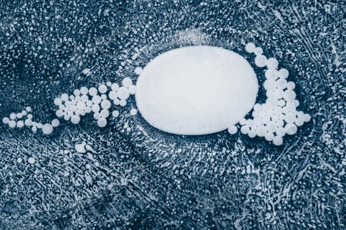 Preview: Amazing patterns of bubbles on the frozen ice of Lake Baikal in winter. Blue abstract background.