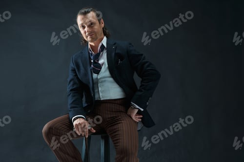 Preview: Businessman Sitting On An Armchair
