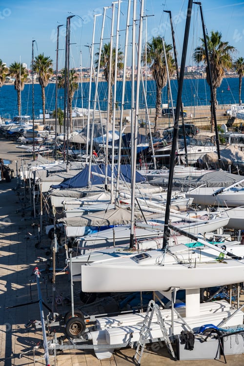 Preview: Yachts in a marina against the background of the city and other ships, in Cascais, Portugal