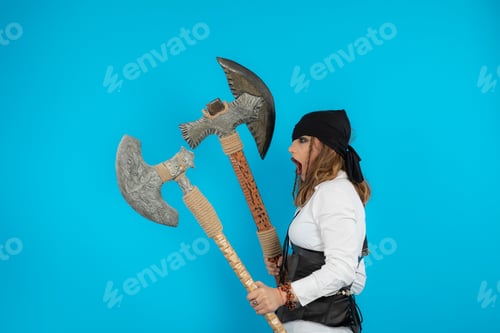 Preview: Angry young pirate holding axes and screaming