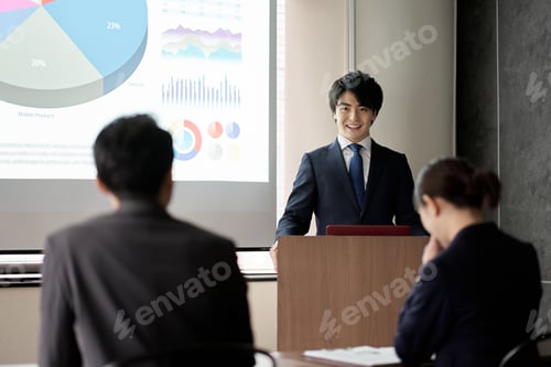 Preview: Asian businessman giving a presentation at a conference