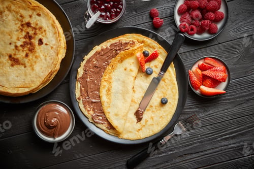 Preview: Delicious chocolate homemade pancakes on black ceramic plate