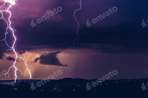 Preview: Night landscape on a background of thunderstorms. Rural silhouette and clouds with lightning flashes