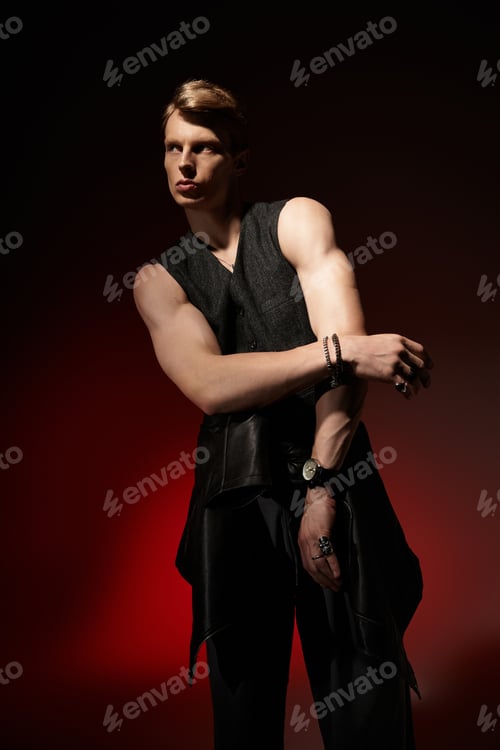 Preview: Young man expresses modern masculinity with alluring confidence in striking lighting