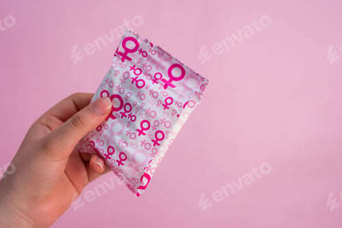 Preview: Women's hygiene pad and pink women's symbol on the package