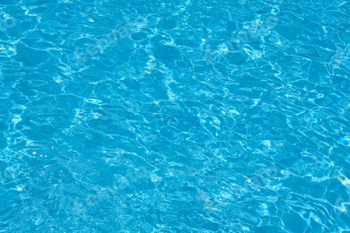 Preview: Closeup surface of blue clear water with small ripple waves in swimming pool.