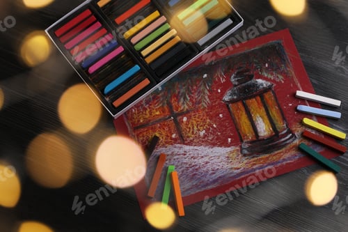 Preview: Colorful chalk pastels and beautiful painting on black wooden table, above view. Bokeh effect