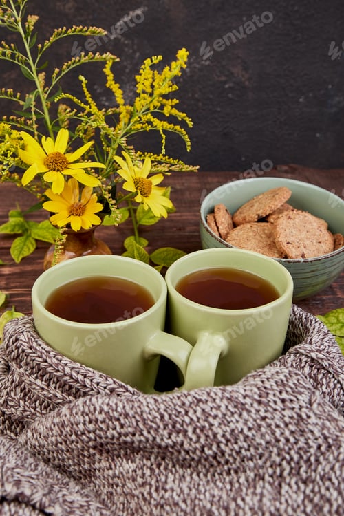 Preview: Knitted scarf with warm cup of tea