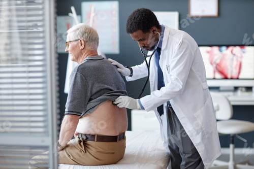 Preview: of Black Doctor Using Stethoscope Examining Senior Patient in Checkup