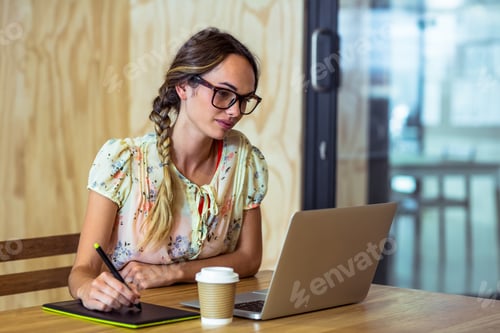 Preview: Graphic designer using graphics tablet
