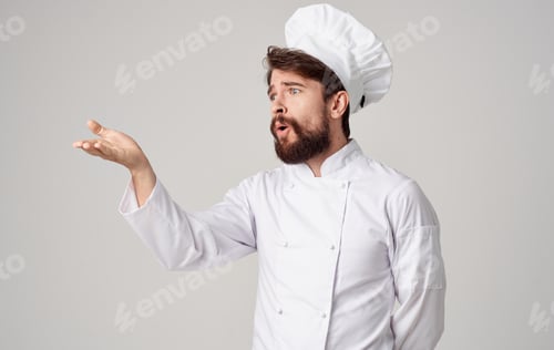 Preview: Male cook Professional restaurant working in the kitchen