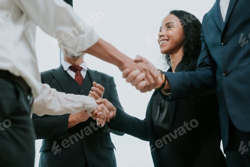 Preview: Large professional business person team meeting to showing group unity with their hands together