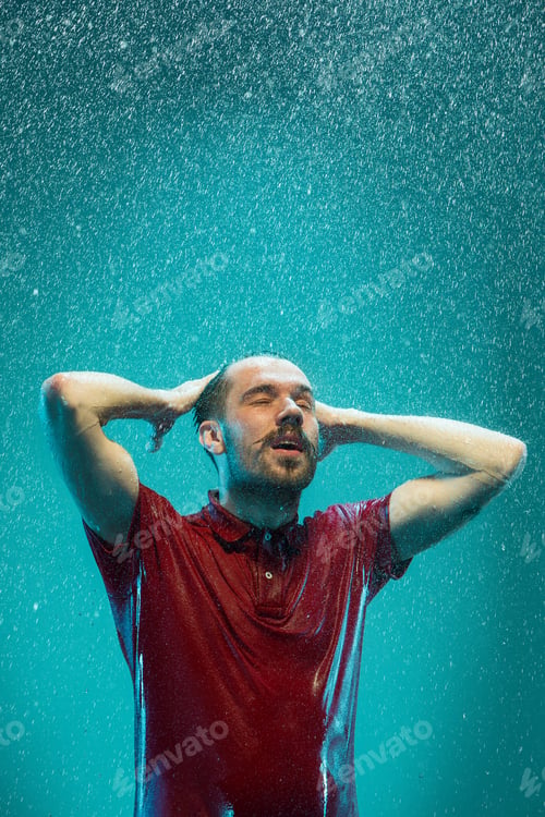 Preview: The portrait of young man in the rain