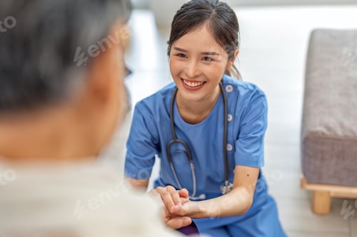 Vista previa: Care giving nurse working home care service hold hand aging elderly not too worry boost up morale