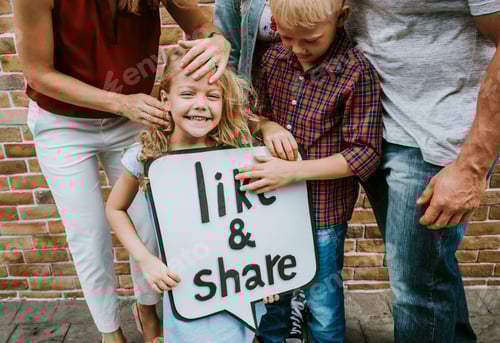 Preview: Family holding a like and share sign