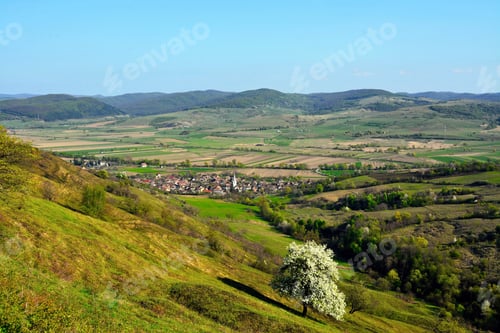 Preview: Mesmerizing shot of a countryside landscape under a blue sky