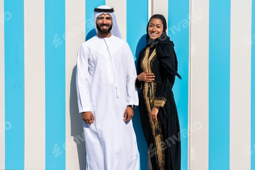 Preview: Traditional arab couple wearing emirati clothing dating outdoors
