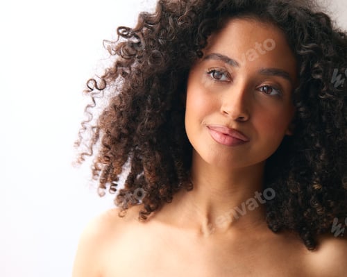 Preview: Studio Portrait Of Smiling Natural Woman With Bare Shoulders Standing Against Neutral Background