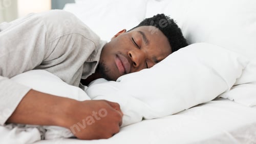 Preview: Sleep, relax and dream for a black man home in bed on a weekend morning. Tired, sleeping and dreami