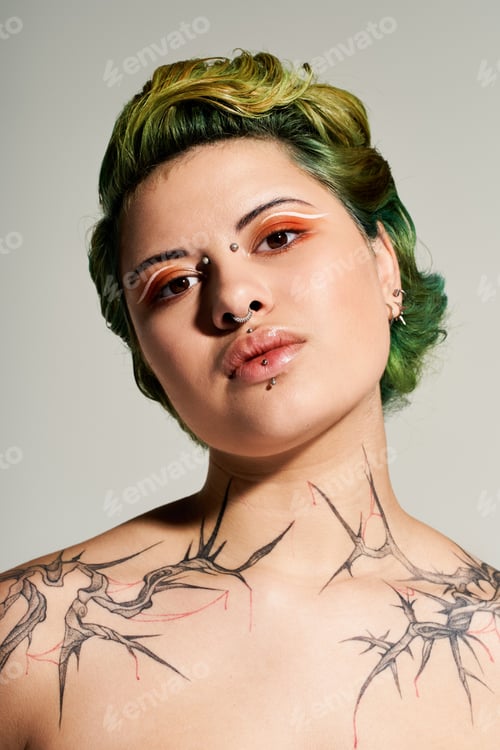 Preview: Vibrant young woman showcasing bold fashion and striking tattoos in modern studio setting