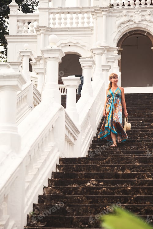 Preview: Adult woman 50 years old on steps stair Sri Lankan Buddhist temple
