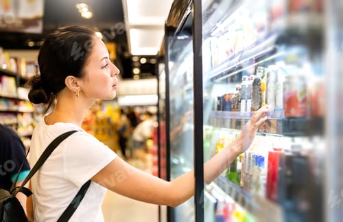 Preview: Portrait of caucasian woman looking at product at grocery store