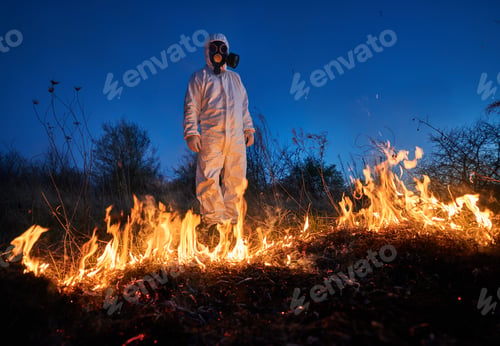 Preview: Firefighter ecologist working in field with wildfire.