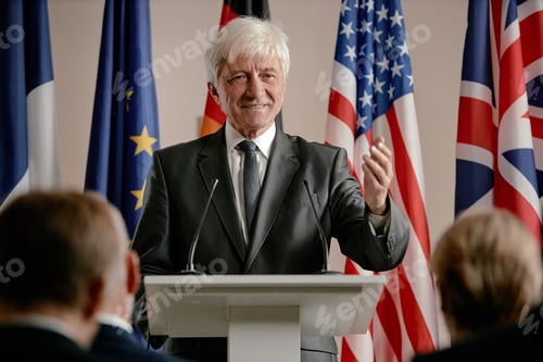 Preview: Senior Caucasian Man Giving Speech at Podium during International Conference