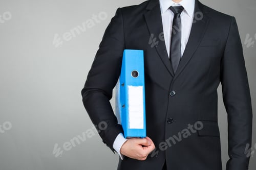 Preview: Confident businessman holding a document folder