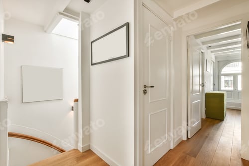 Preview: a hallway with white walls and wooden floors and a