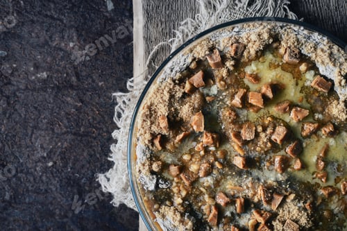 Preview: Raw pumpkin dump cake in the baking dish on the stone background top view